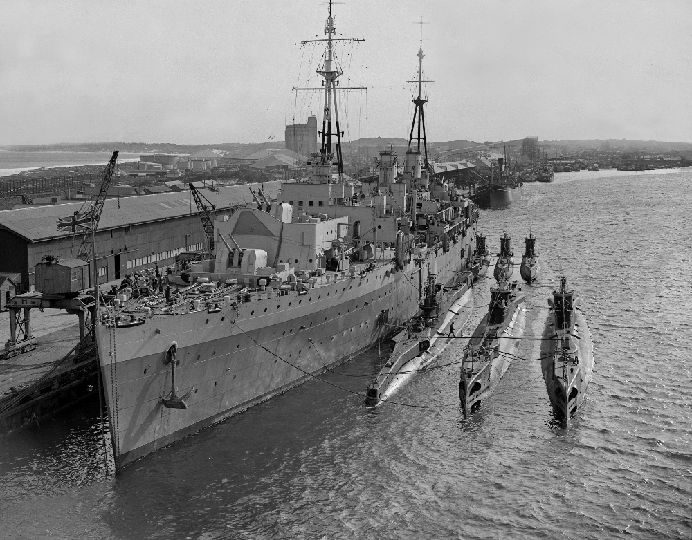 8 - British submarines and depot ship HMS Adamant at North Wharf 1945 - Family of Saxon Fogarty (1000x781)